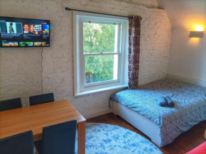 Mezzanine style studio apartment 8